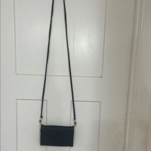 This is the perfect travelers, Crossbody bag. Black, compact, no flaws